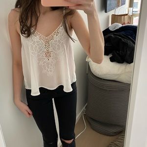 Brandy melville floral style white tank. Style no longer sold and unworn